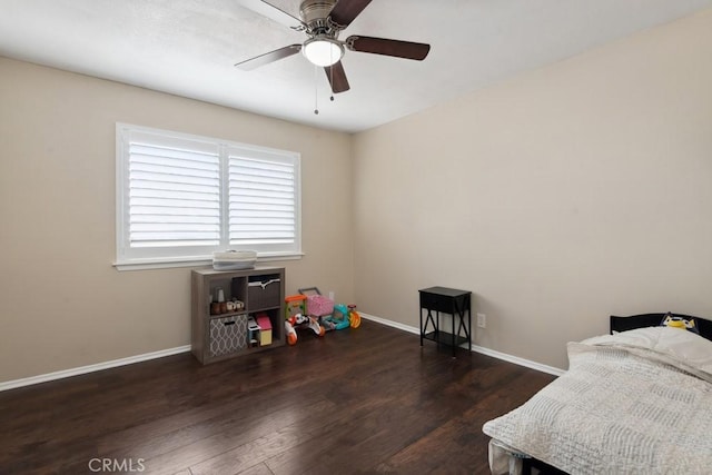 bedroom featuring ceiling fan and dark hardwood / wood-style floors