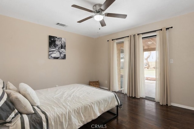 bedroom with dark hardwood / wood-style floors, ceiling fan, and access to exterior