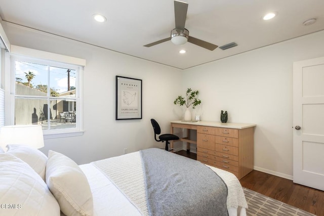 bedroom featuring dark hardwood / wood-style flooring and ceiling fan