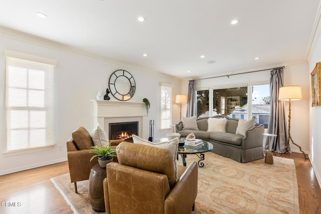 living room with ornamental molding and light wood-type flooring