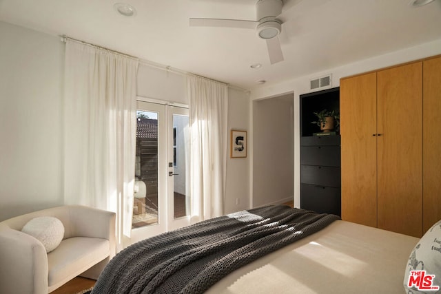 bedroom featuring french doors and ceiling fan