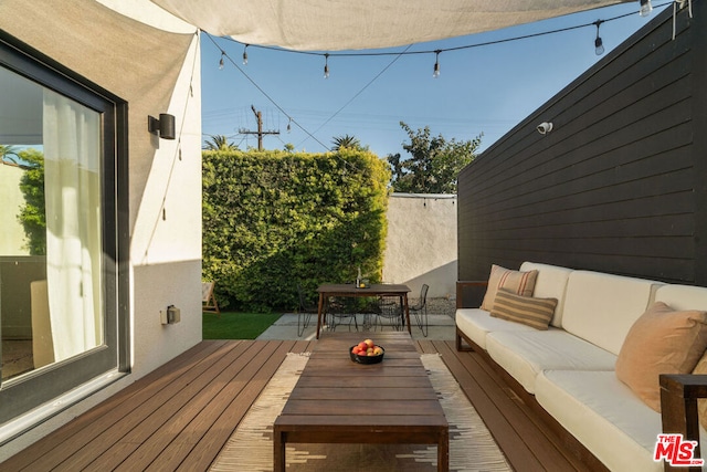 deck with an outdoor hangout area