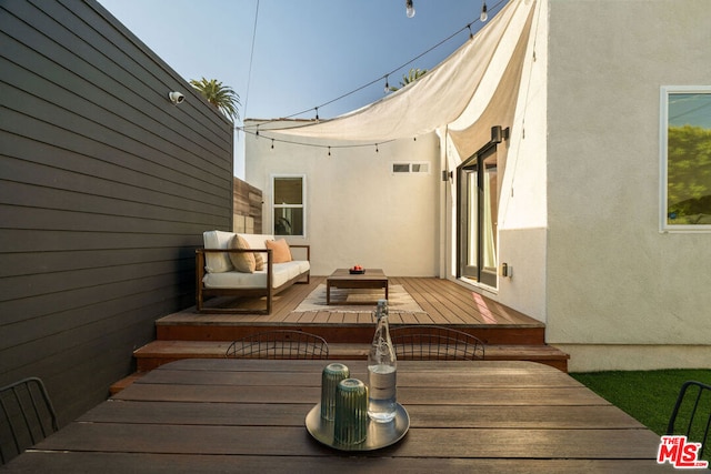 deck with an outdoor living space