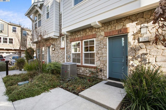 doorway to property with central AC