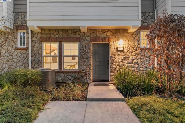 entrance to property featuring central AC unit