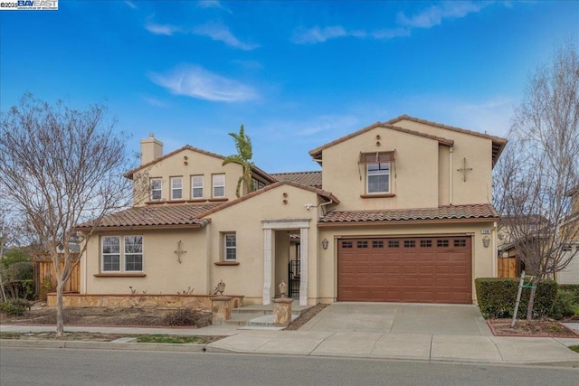 mediterranean / spanish-style house featuring a garage