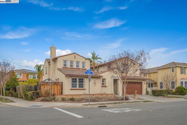 mediterranean / spanish-style home featuring a garage