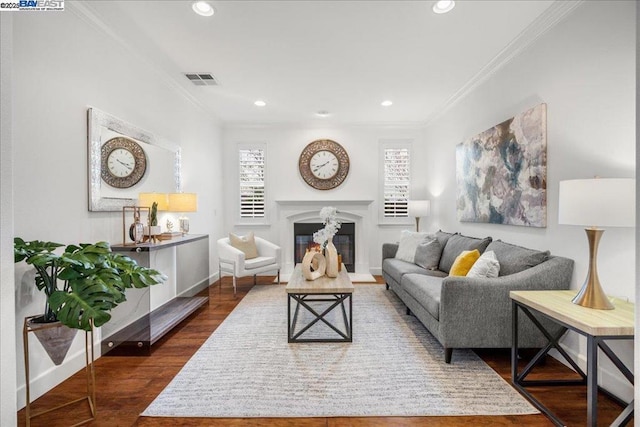 living room with ornamental molding and dark hardwood / wood-style flooring