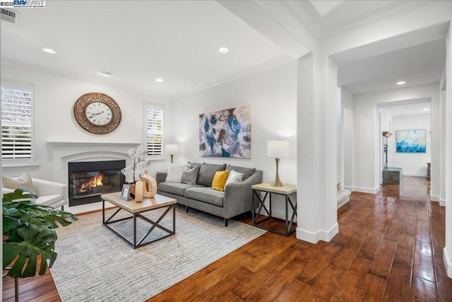 living room with crown molding and dark hardwood / wood-style floors