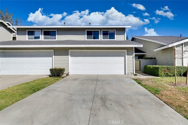 view of front of house with a garage and a front yard