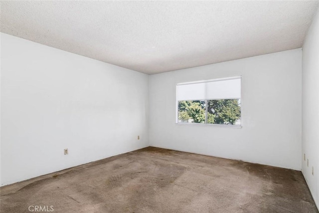 unfurnished room featuring carpet floors