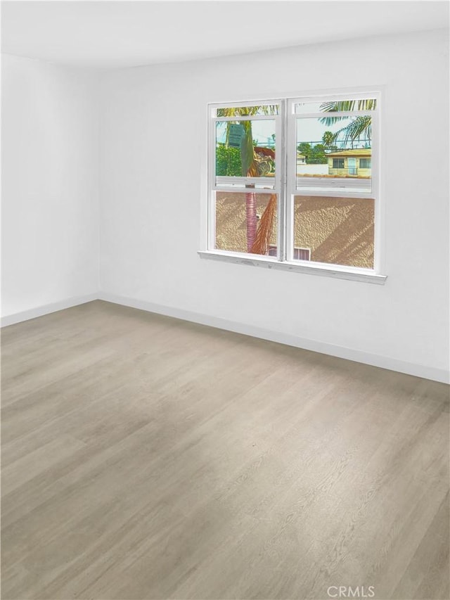 empty room featuring hardwood / wood-style flooring