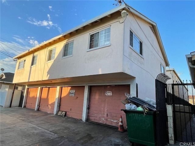 rear view of house featuring a garage