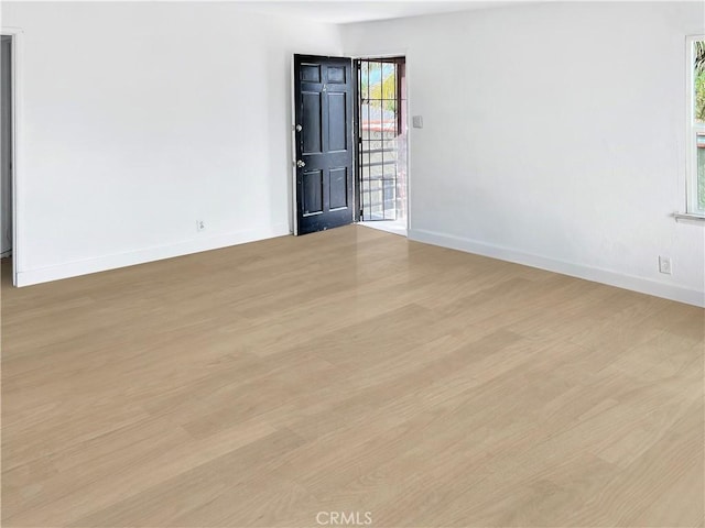 spare room with light wood-type flooring