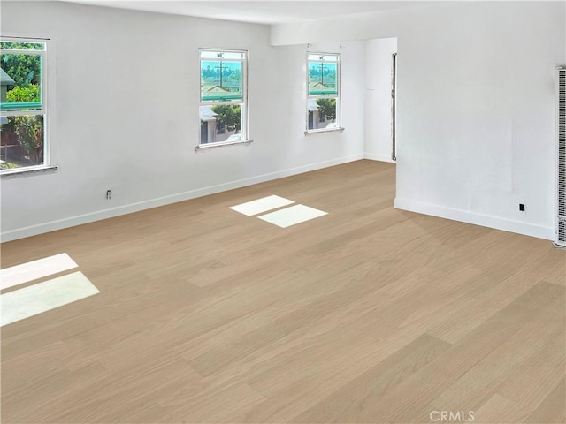 unfurnished room featuring light hardwood / wood-style flooring