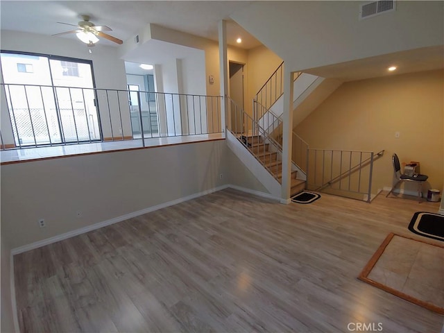 unfurnished room featuring hardwood / wood-style flooring and ceiling fan