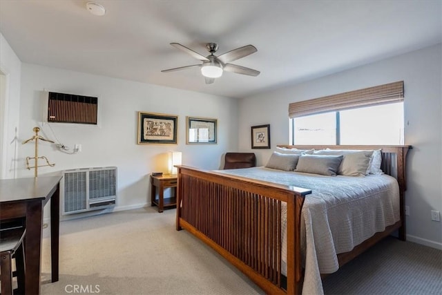 bedroom featuring light carpet and ceiling fan