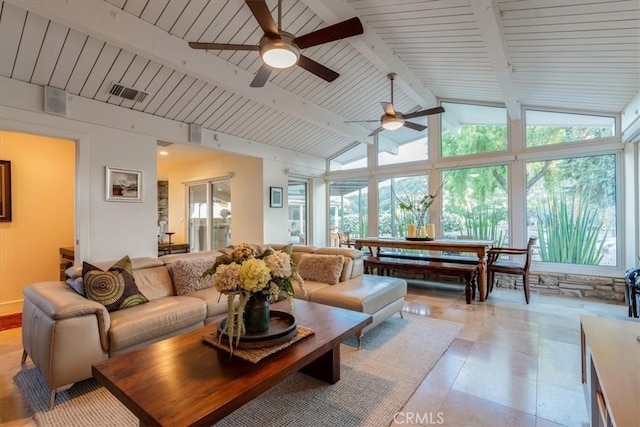 living room featuring lofted ceiling with beams