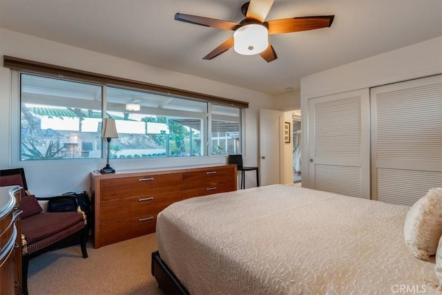 bedroom featuring carpet floors, a closet, and ceiling fan