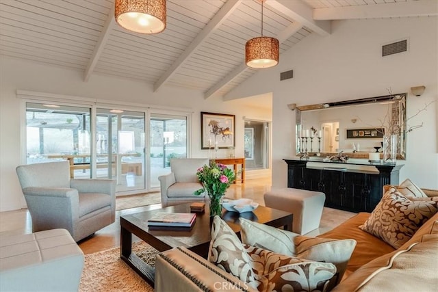 living room with high vaulted ceiling and beam ceiling