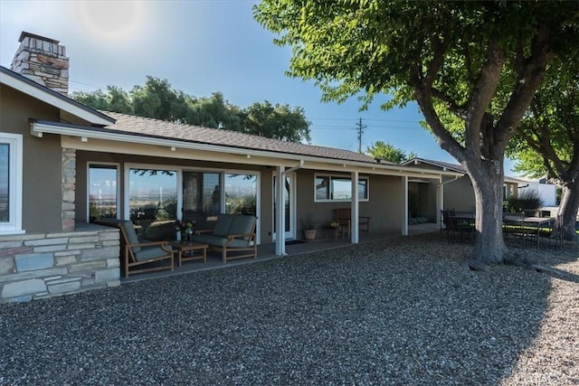 rear view of property with a patio