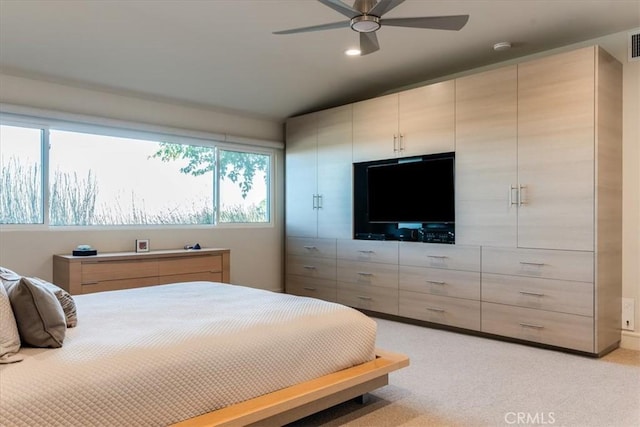 carpeted bedroom featuring ceiling fan