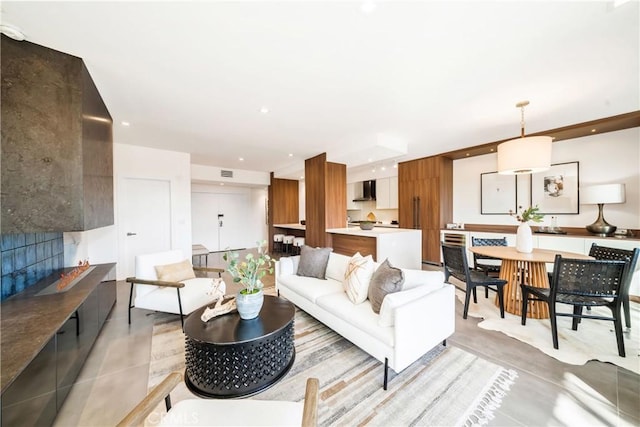 living room featuring visible vents and recessed lighting