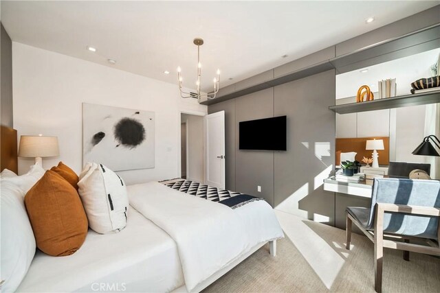 bedroom featuring an inviting chandelier