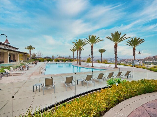 view of pool featuring a patio area