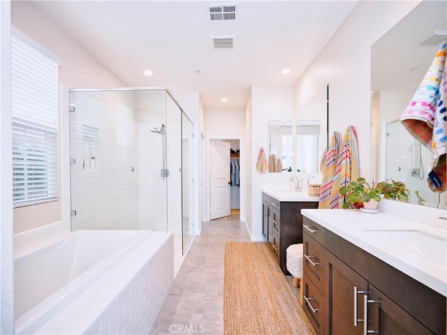 bathroom with vanity, separate shower and tub, and tile patterned floors