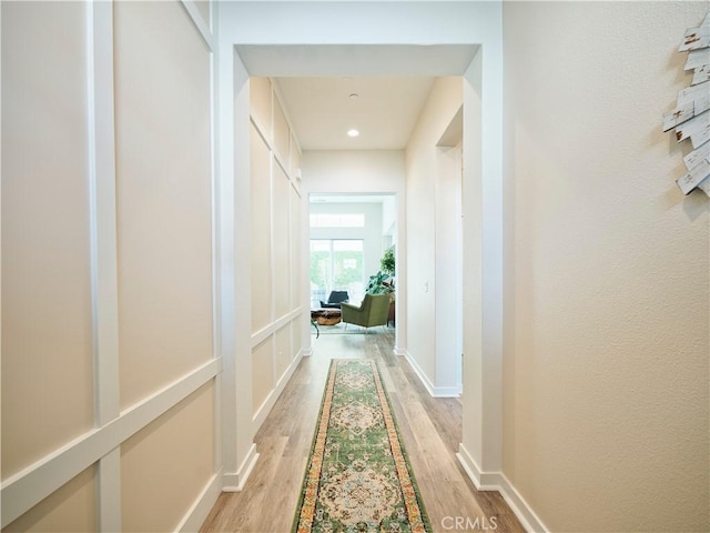 hall with light hardwood / wood-style floors