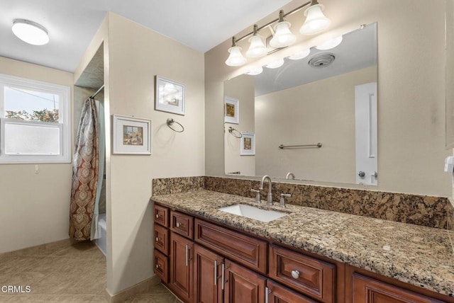 bathroom with vanity, tile patterned flooring, and shower / bathtub combination with curtain