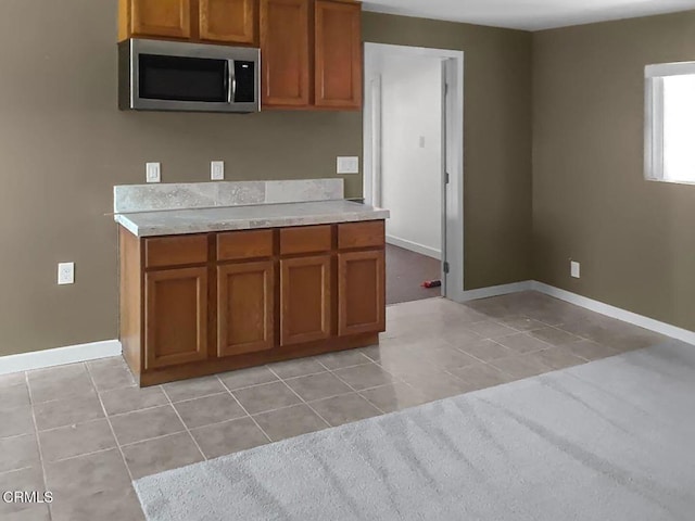 kitchen featuring light tile patterned flooring