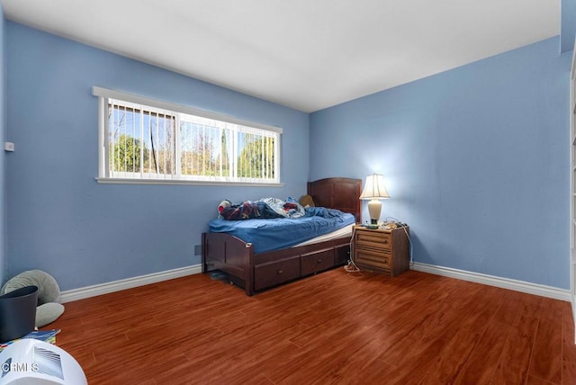 bedroom featuring hardwood / wood-style flooring