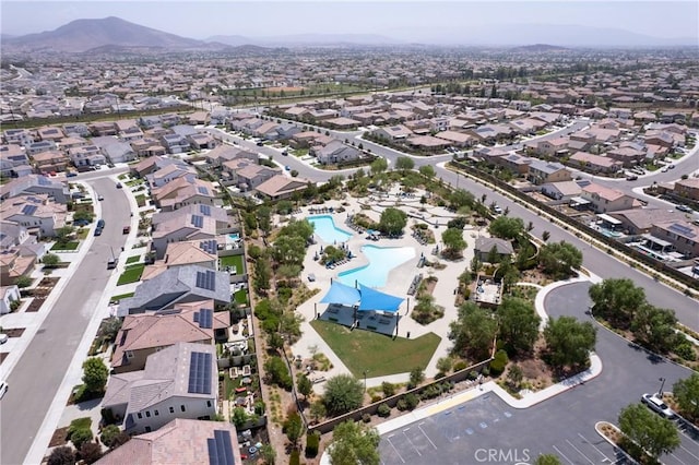 birds eye view of property with a mountain view