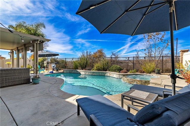 view of pool featuring an outdoor living space, an in ground hot tub, and a patio area