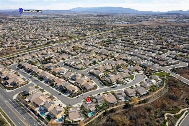 birds eye view of property featuring a mountain view