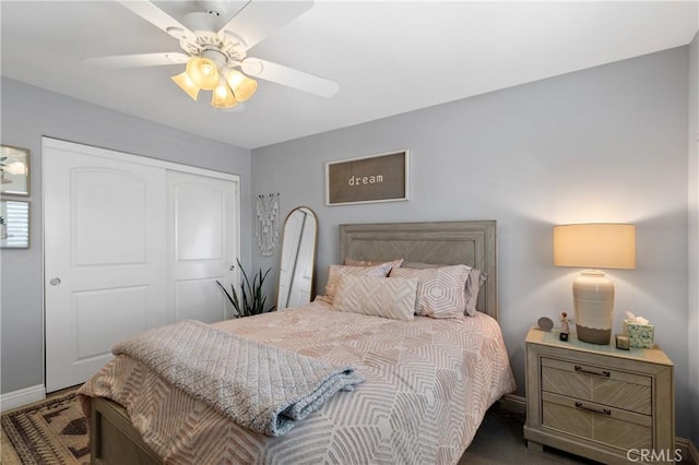 bedroom with ceiling fan and a closet