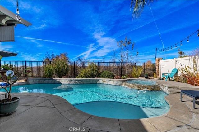 view of swimming pool featuring a patio and an in ground hot tub