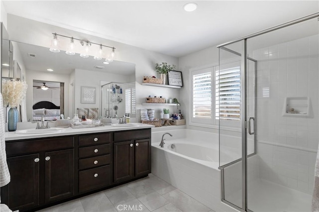 bathroom with vanity, tile patterned floors, and separate shower and tub