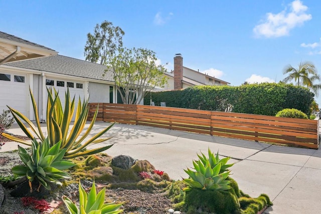 view of patio / terrace featuring a garage