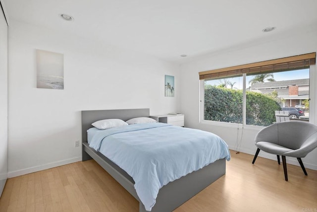 bedroom with light hardwood / wood-style flooring