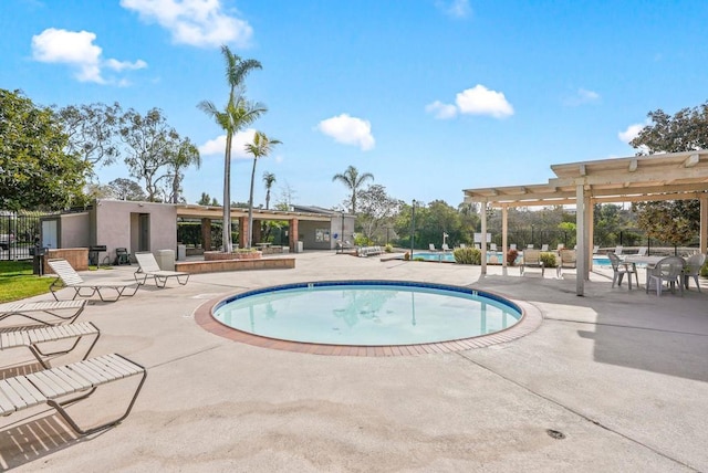 view of pool with a pergola and a patio