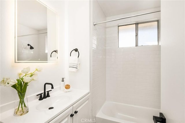 full bath featuring vanity and  shower combination