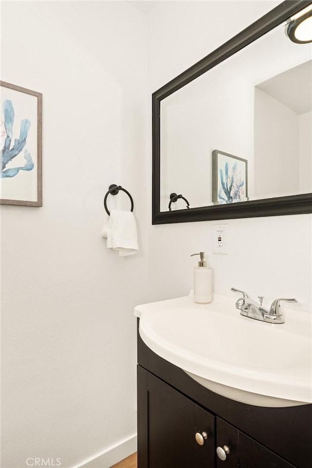 bathroom featuring vanity and baseboards