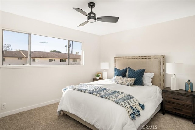 bedroom with baseboards, carpet, and a ceiling fan