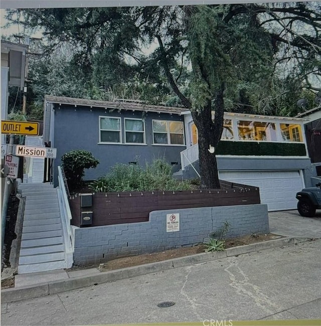 view of front of home with a garage