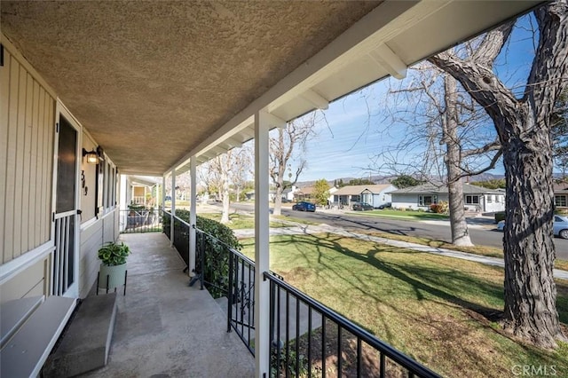 view of patio featuring a porch