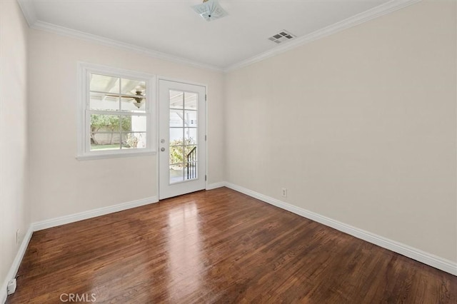 spare room featuring crown molding and wood-type flooring