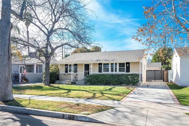 single story home with covered porch and a front lawn